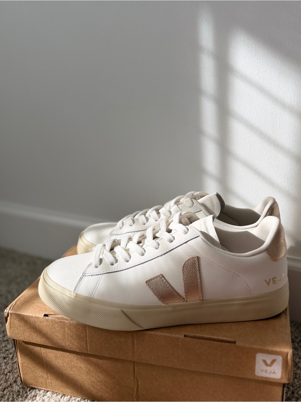 Veja White Sneakers with a gold metallic finish.